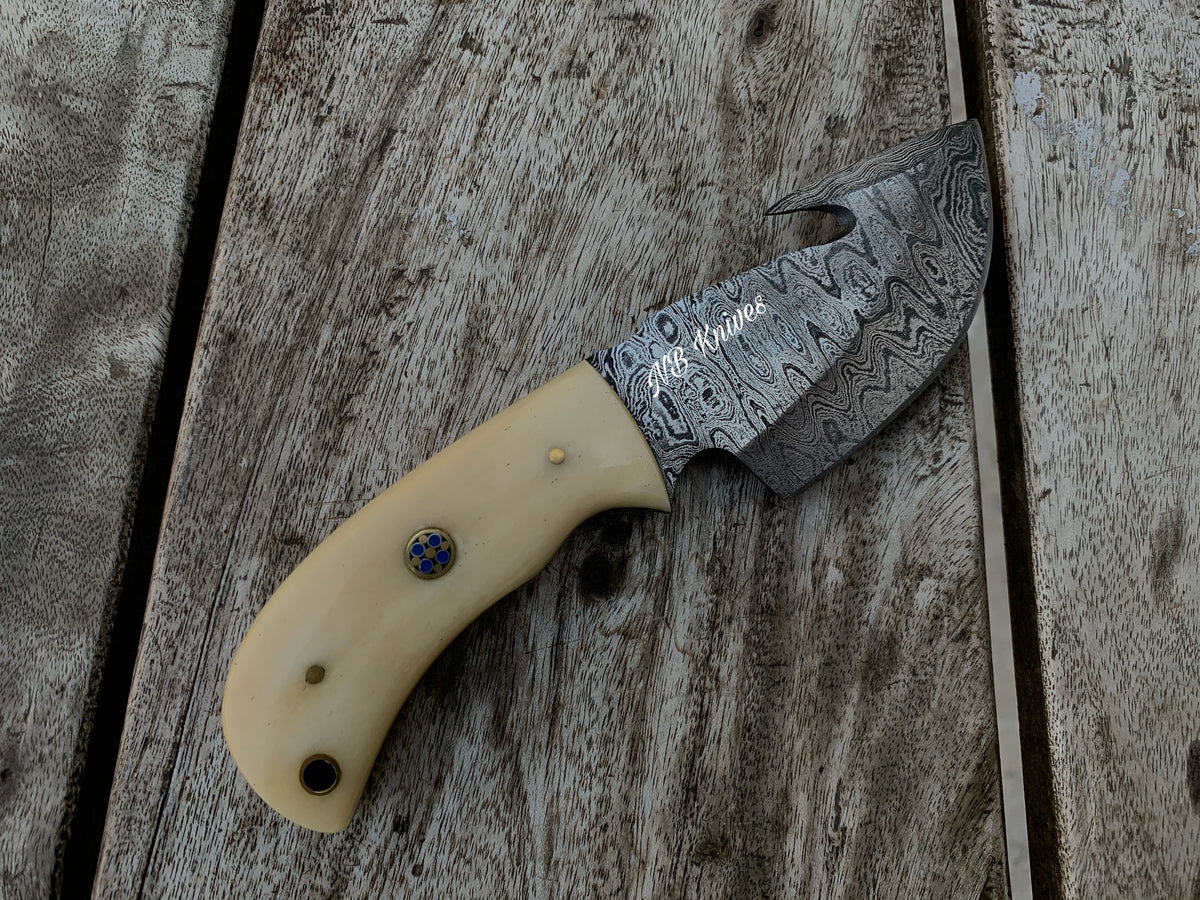 Hand-Forged Damascus Gut Hook Skinner Knife – Camel Bone Handle