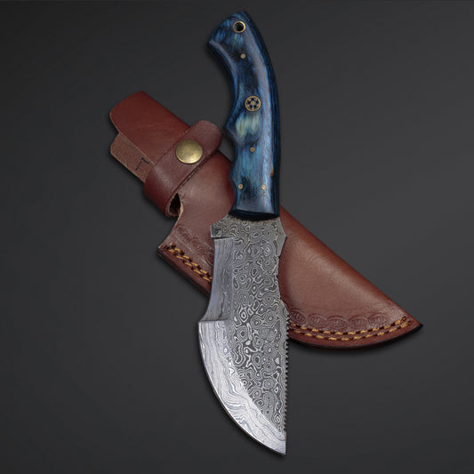 A custom handmade Damascus steel tracker knife with a blue Pakka Wood handle and a leather sheath.