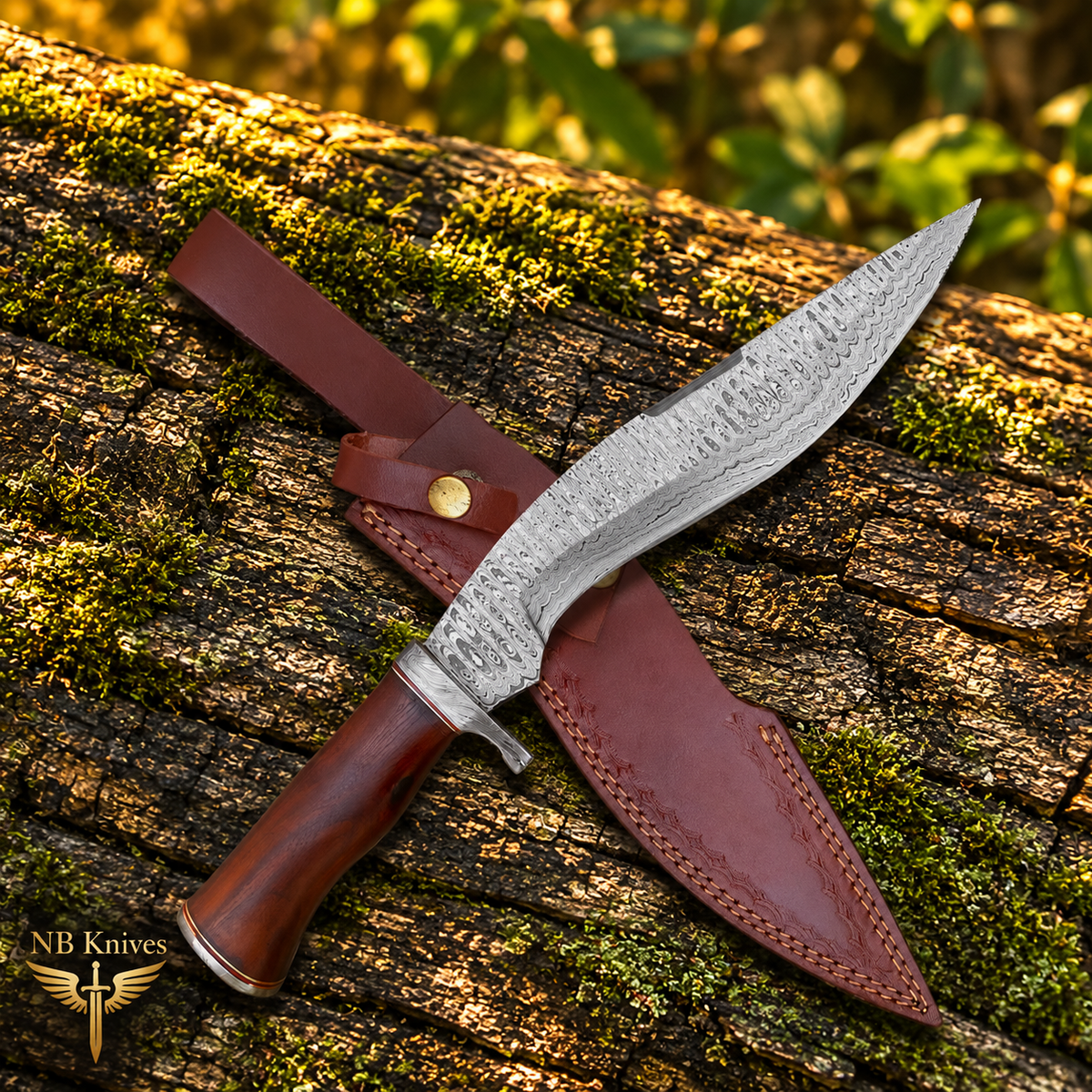 A Damascus steel blade knife with a brown wooden handle and a brown leather sheath, displayed diagonally on a mossy log outdoors. The NB Knives logo is visible in the bottom-left corner.