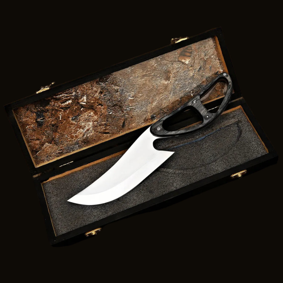 Knife in a wooden box on a natural background