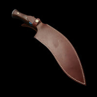 Brown leather knife sheath on a dark background