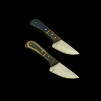 Two knives with wooden handles on a dark textured surface