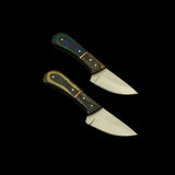 Two knives with wooden handles on a dark textured surface