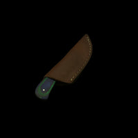Brown leather knife sheath on a dark textured background