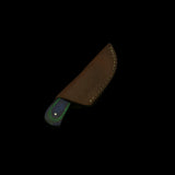 Brown leather knife sheath on a dark textured background
