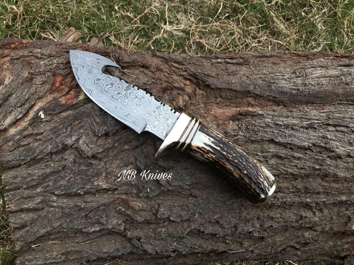 Custom handmade Damascus gut hook knife with genuine Stag Horn handle and leather sheath