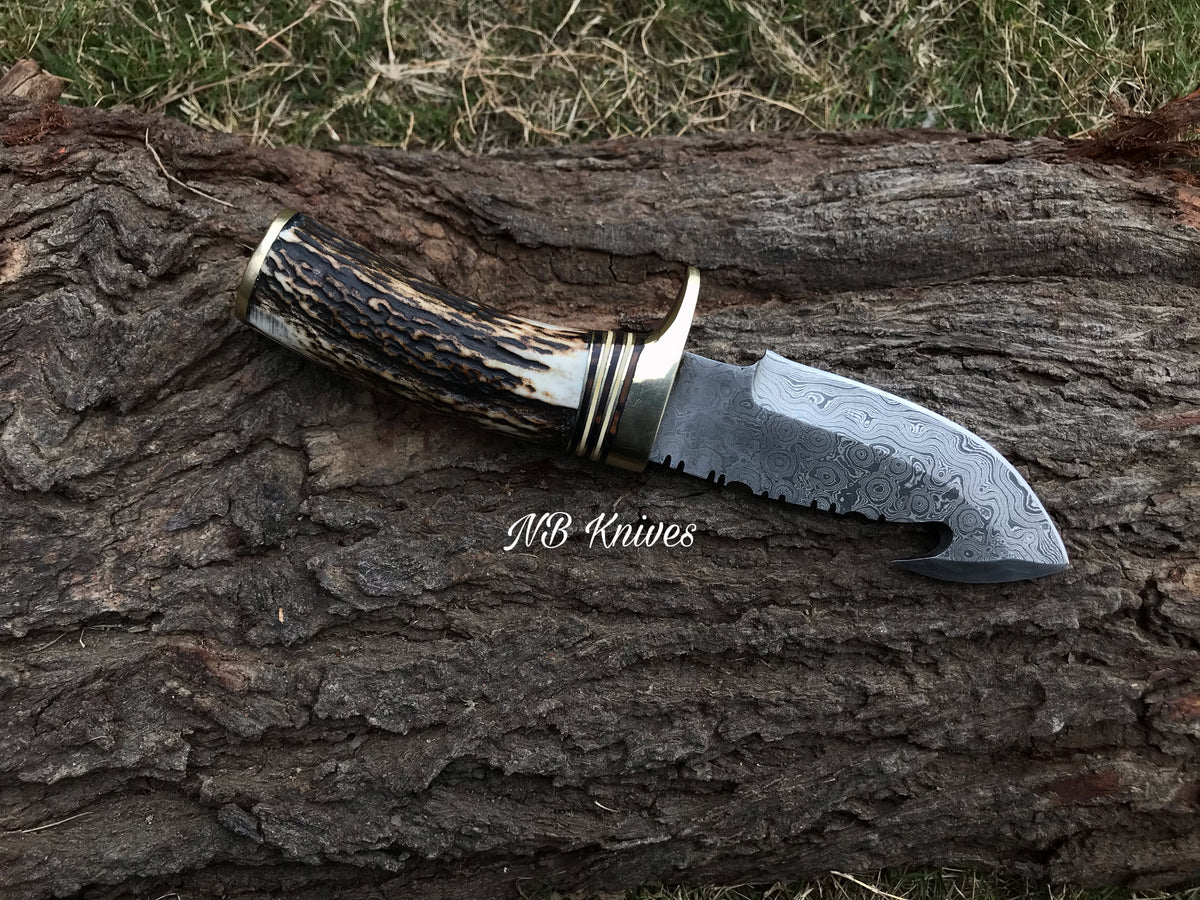 Custom handmade Damascus gut hook knife with genuine Stag Horn handle and leather sheath